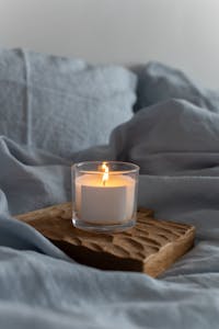 Create a Healing Nook
Set aside one small area—a shelf, a tray, a table.
Place a candle. A sacred object. A photo. A stone that feels good in your hand. Write an intention:
I welcome healing into my life.